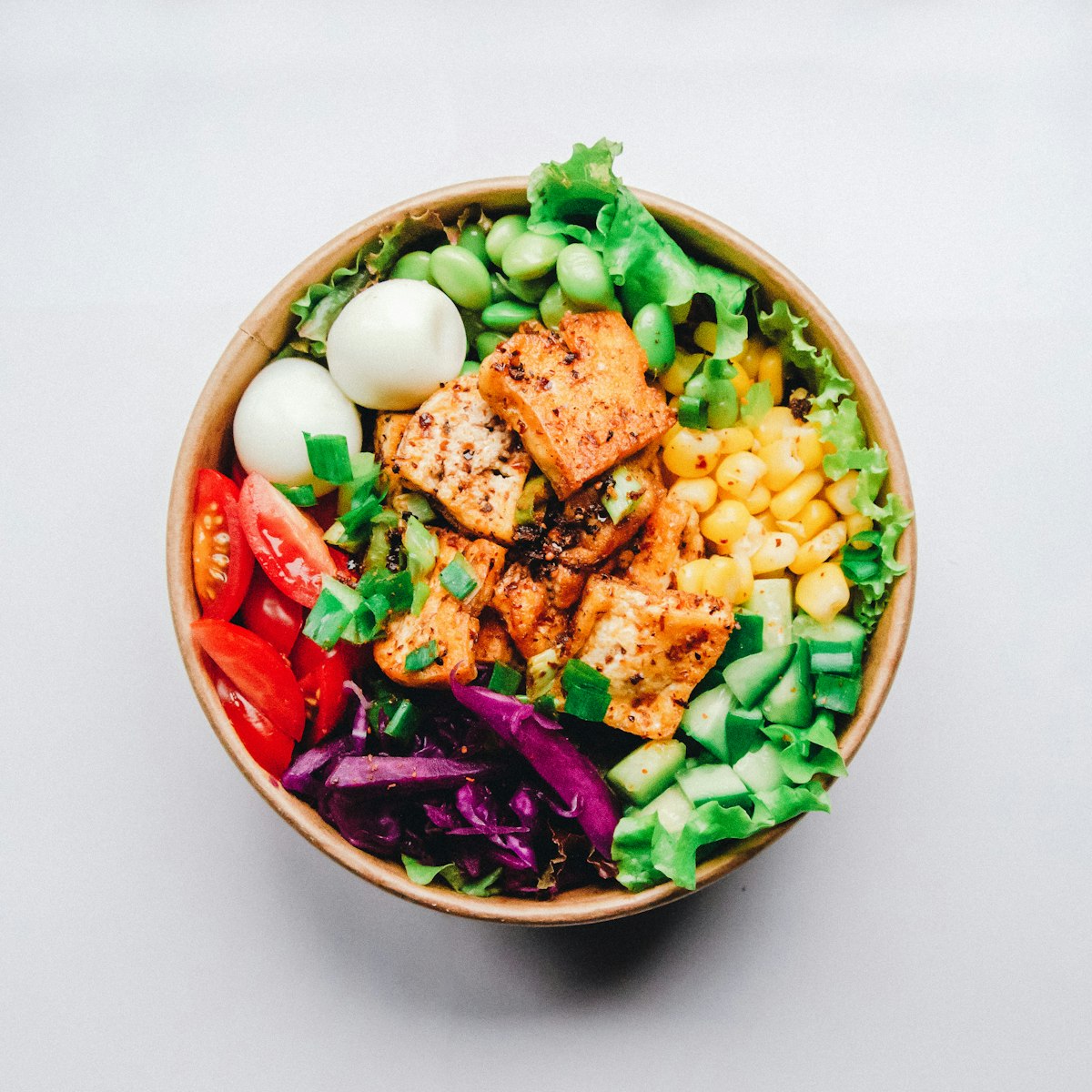 High-protein meal prep containers with variety of foods