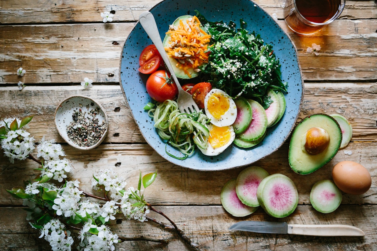 Variety of high-protein foods including chicken, fish, eggs, and dairy